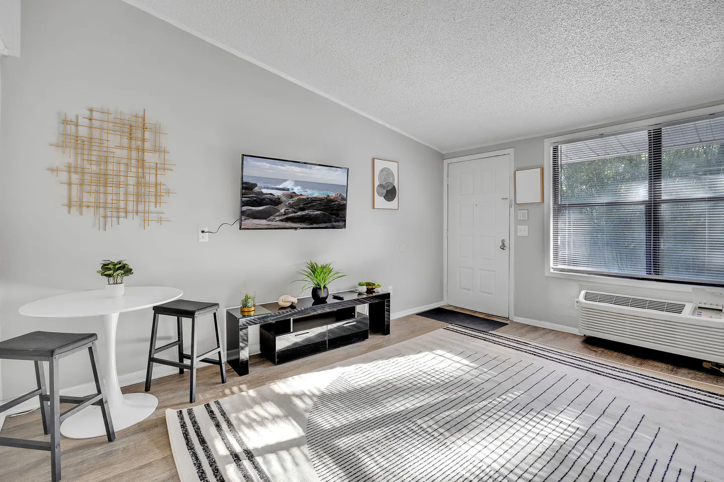 Furnished apartment with warm wood-look flooring