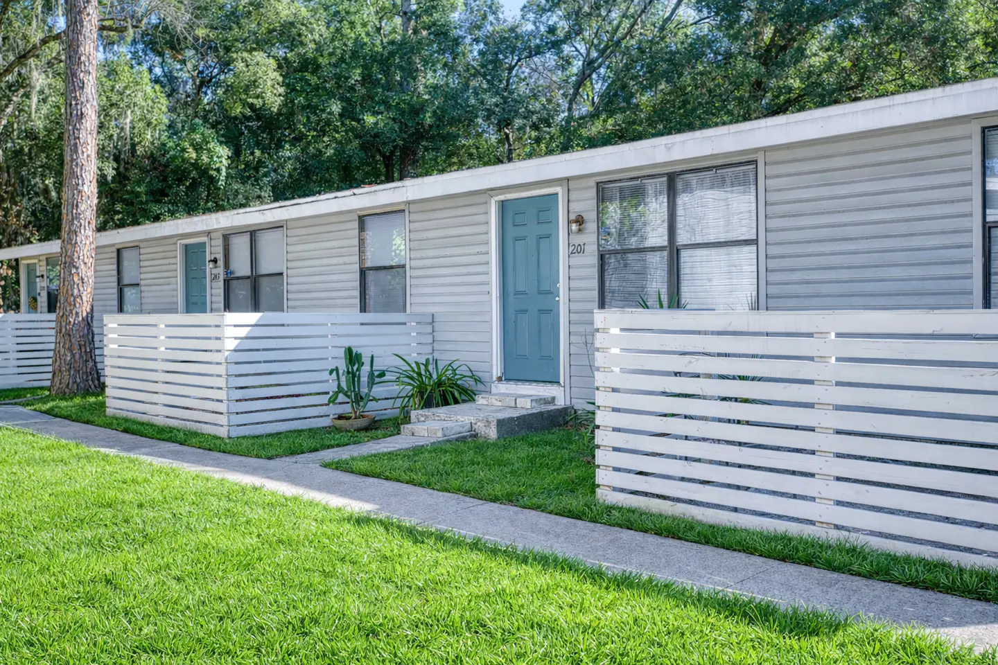 Single-story apartment homes and private outdoor spaces at Vintage Grove